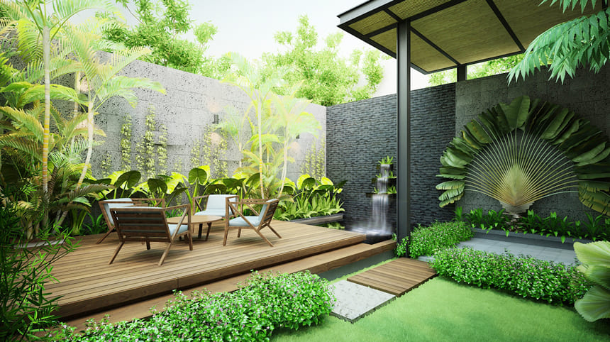Khu vườn nhỏ với sàn gỗ ngoài trời, bàn ghế thư giãn, thác nước trang trí và cây xanh nhiệt đới trong không gian biệt thự hiện đại.